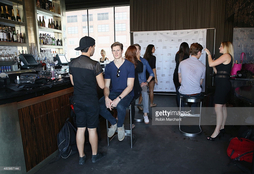 Models prepare backstage at the Sergio Davila show during New York Fashion Week: Men's S/S 2016 Image via Gettyimages.com