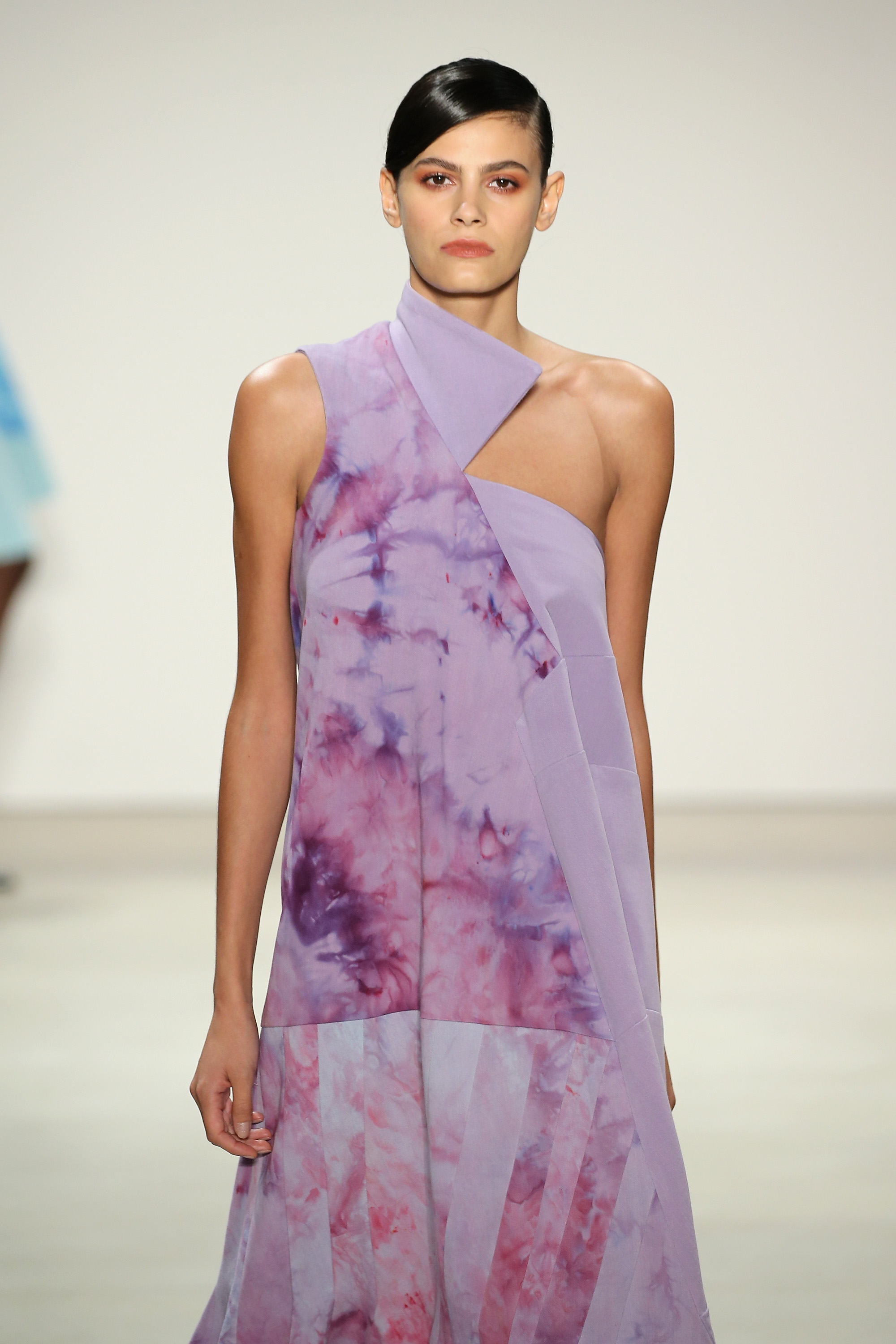 Denim A-line dress splashed in orchid with exaggerated trumpet hem, Courtesy of Supima