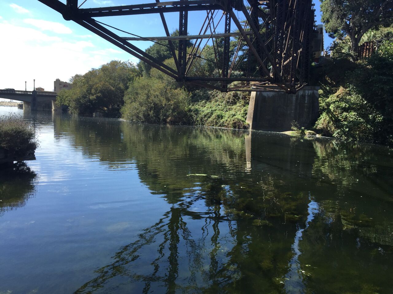 Reflection of old bridge on a river