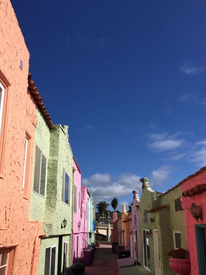 Alley with brightly colored pastel homes