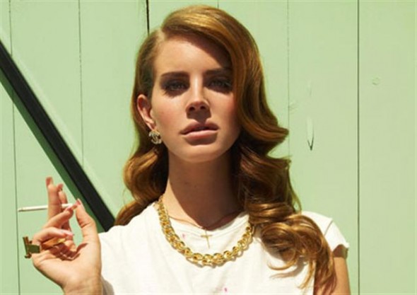 Photo of Lana Del Rey posing and holding a cigarette