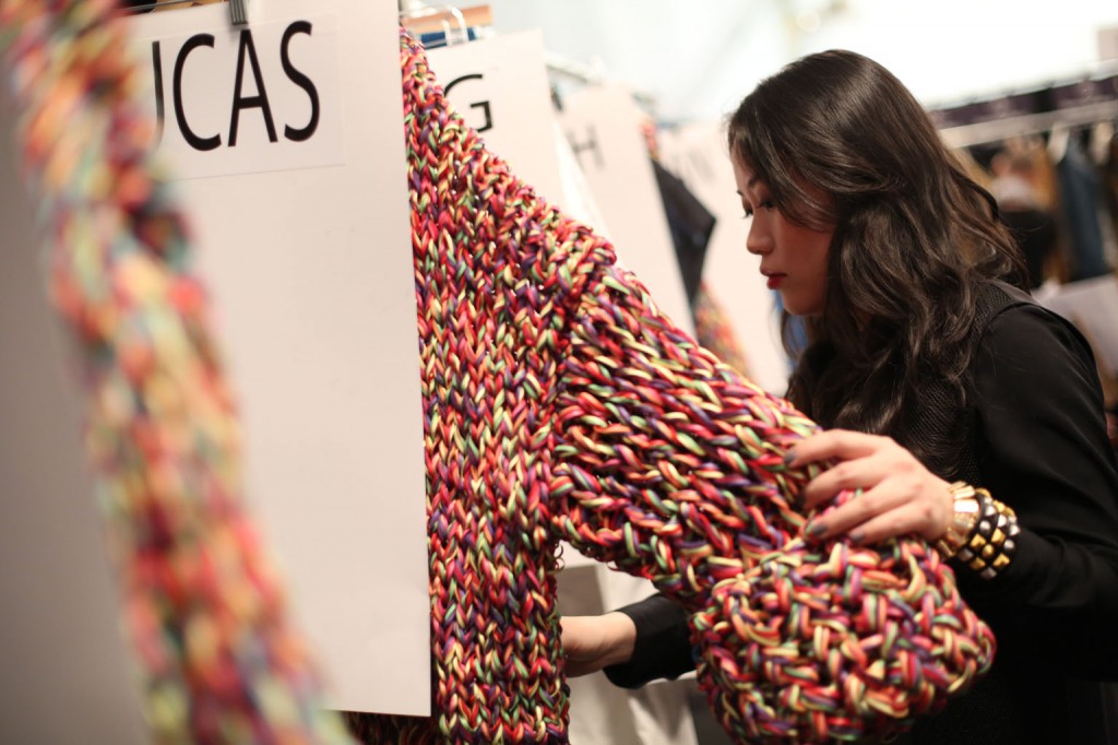 Stella Xingyu Hu, M.F.A. Fashion Design, checking out her collection.  Image: David Dooley