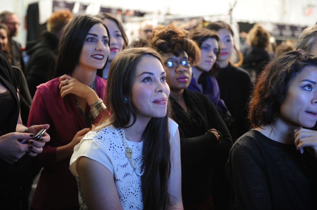 Designers watching and waiting backstage as their  collections come down the runway.   Image: David Dooley