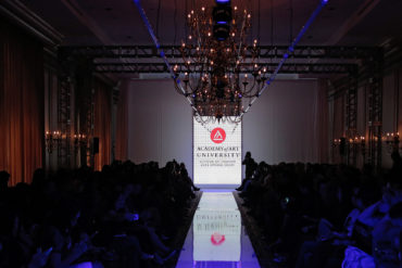 Photo of fashion runway with Academy of Art University logo