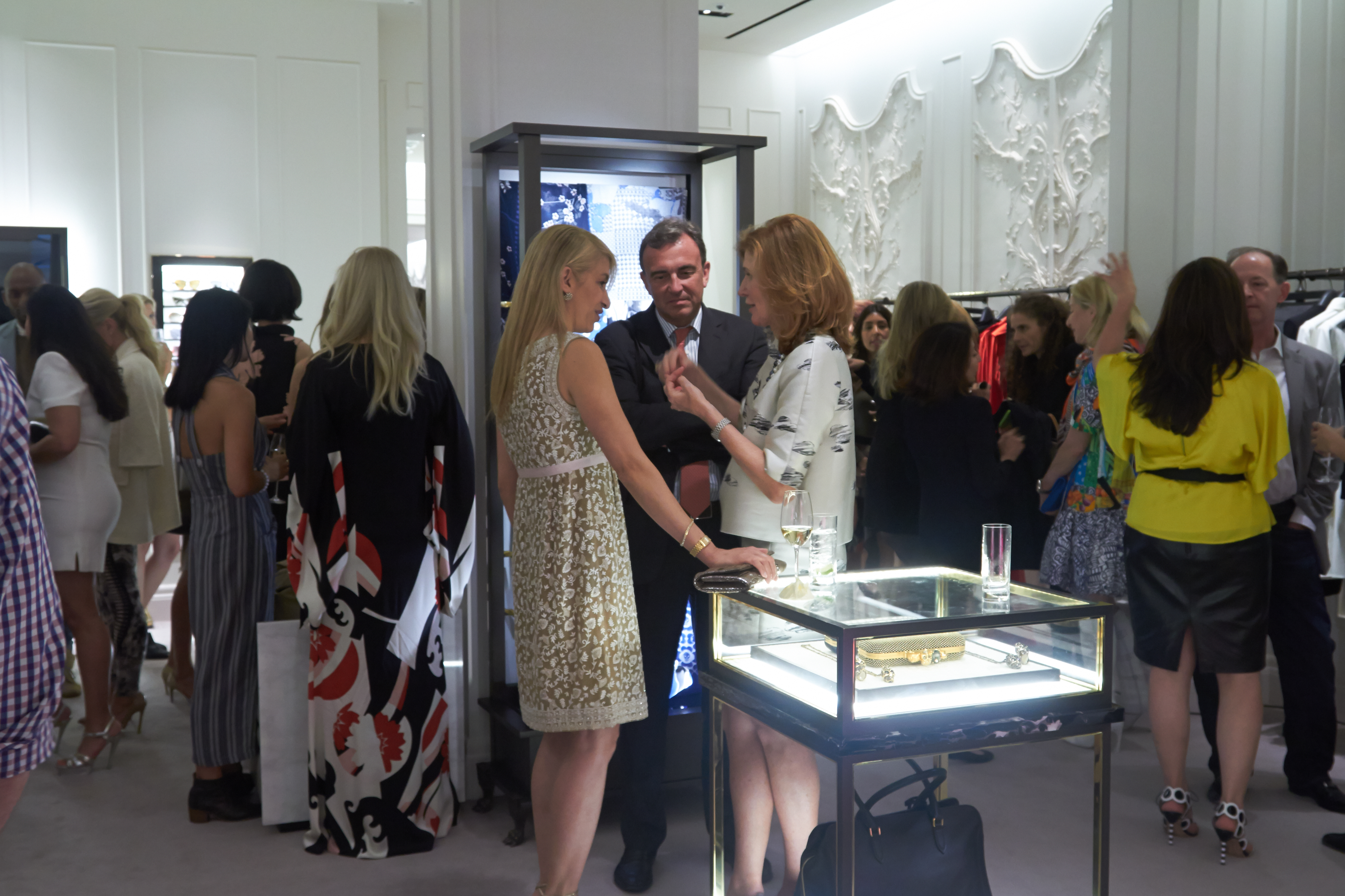 Guests chat and take in the stunning fashion on display during the reception.