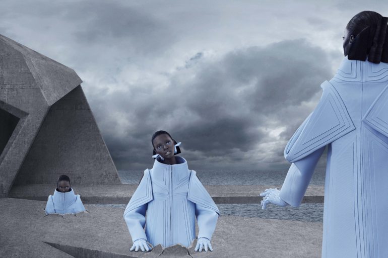 Models in futuristic clothes emerge from the ground