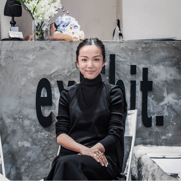 Picture of Yoyo Cao, yoyokulala in front of exhibit
